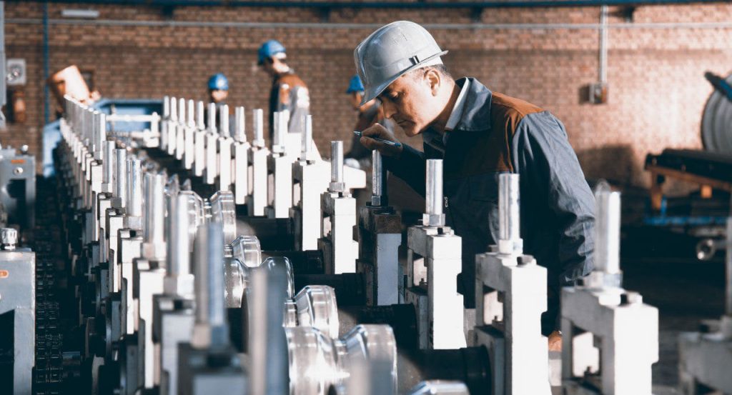 Operator checking a roll-forming line