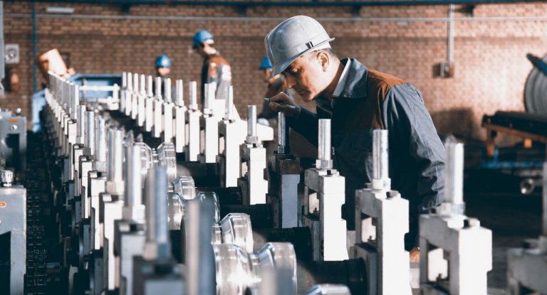 Operator checking a roll-forming line
