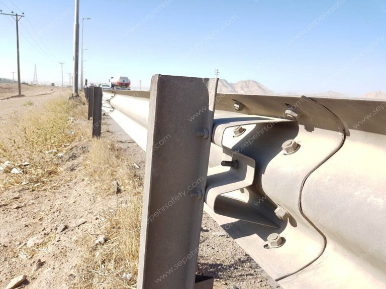 W-beam bolted to an H-section post